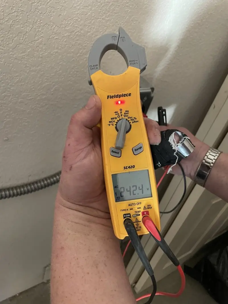 Voltage testing with clamp meter during Ceiling Fan Installation in Charlton